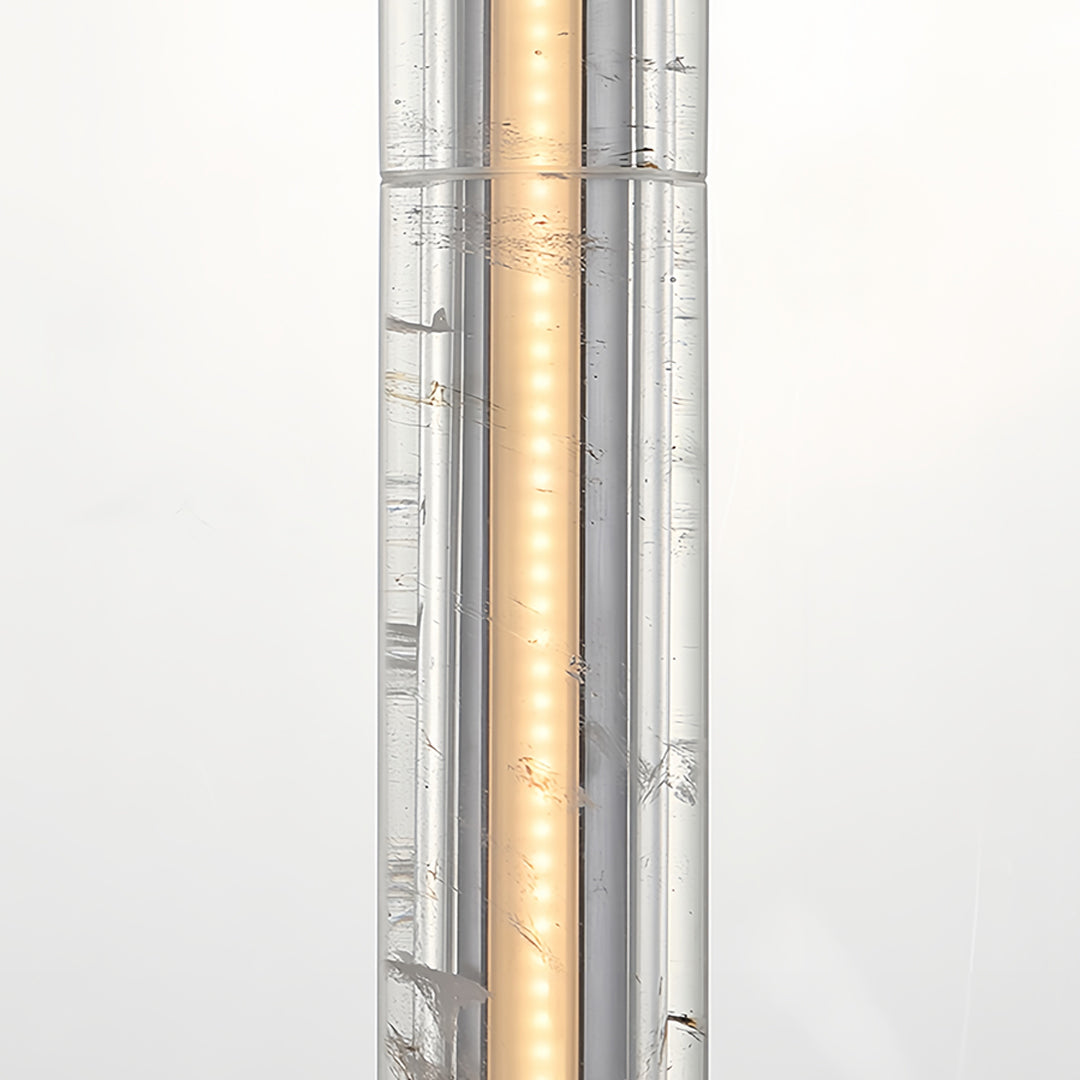 Modern crystal pendant light with a cylindrical crystal body, showcasing its modern and luxurious appeal.