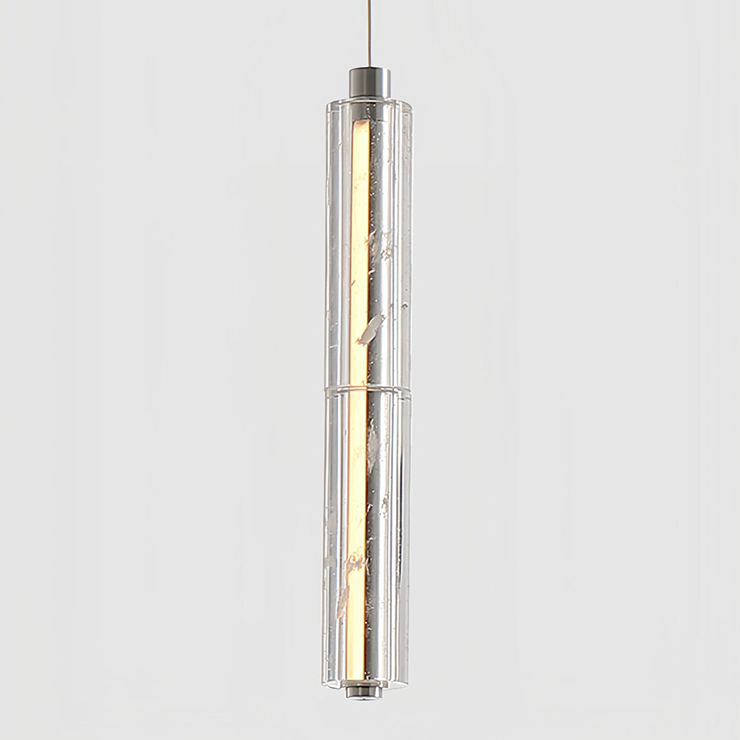 Modern crystal pendant light hanging beside a window, casting a warm glow in a serene bedroom.