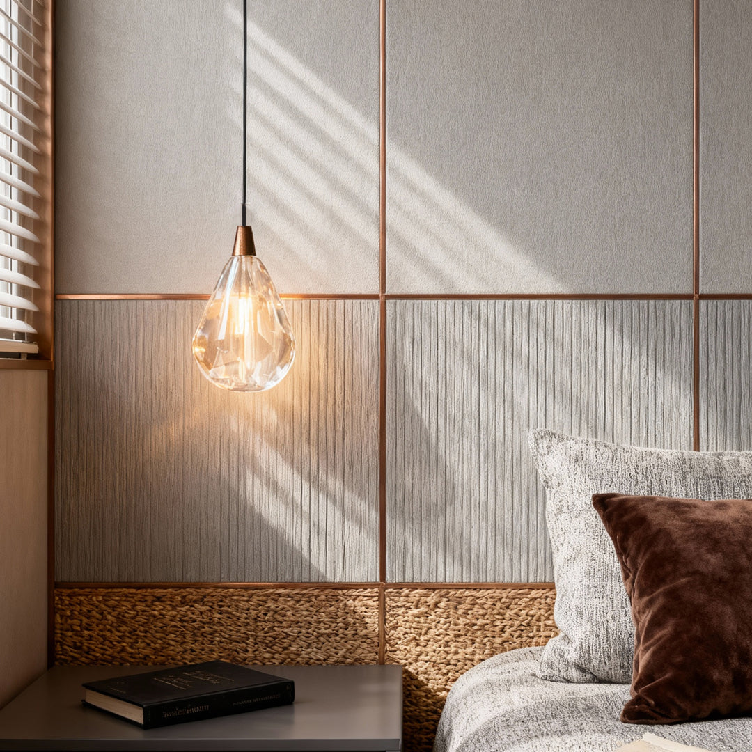 Modern crystal pendant lighting providing bedside illumination in contemporary bedroom with gray textured walls and woven accents
