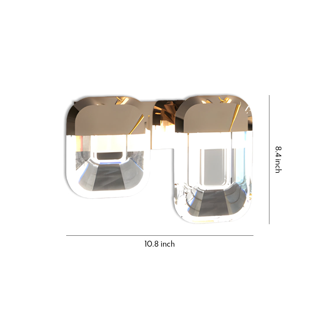 Modern crystal wall sconce lighting featuring dual cube-shaped glass shades with elegant bronze curved detailing