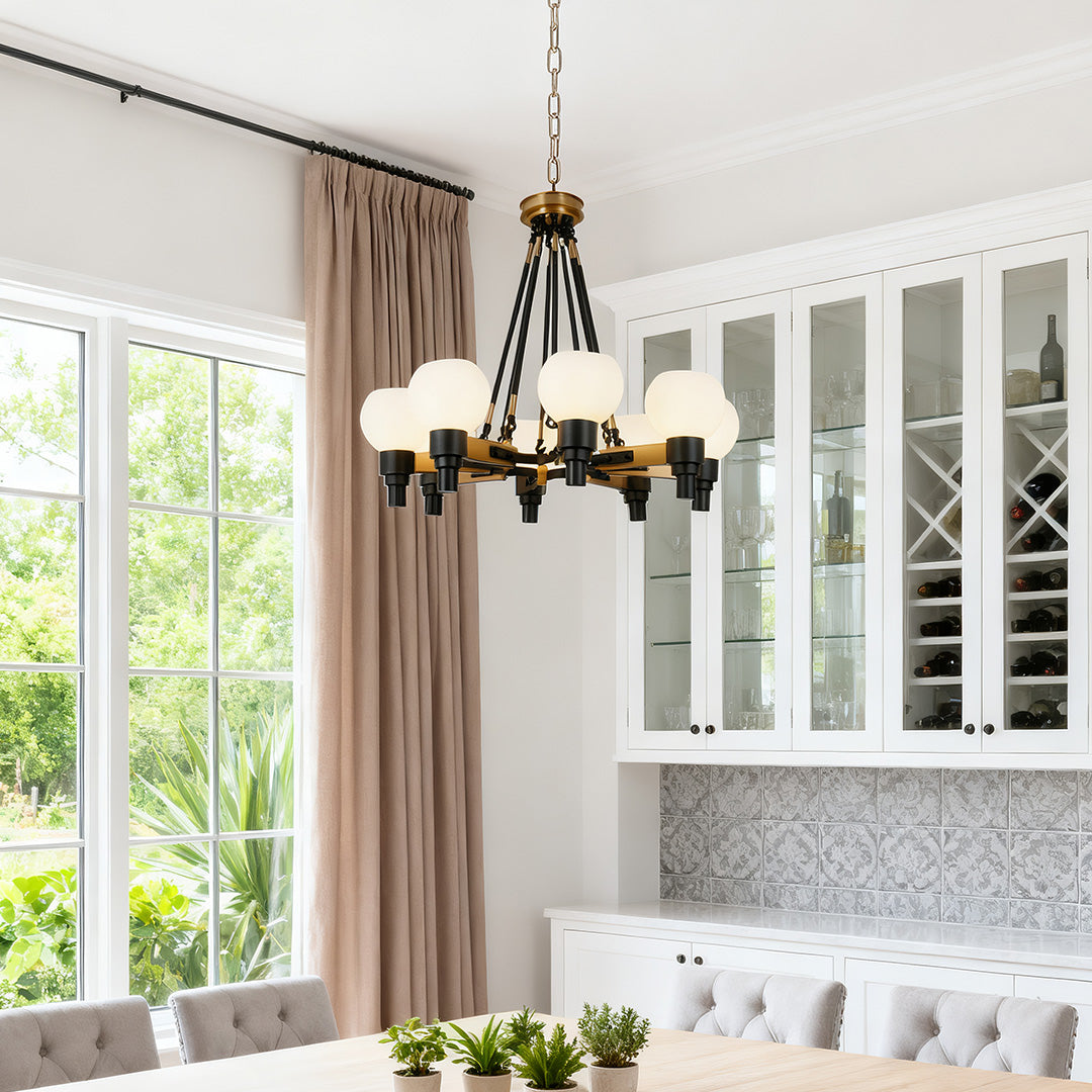 Modern farmhouse 8 light chandeliers featuring a dark bronze finish and exposed candelabra bulbs, accenting a long, live-edge dining table.