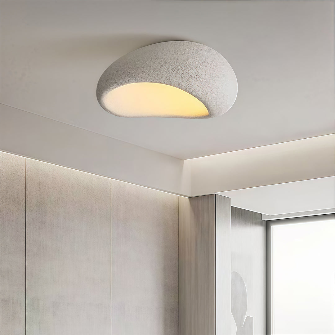 Art deco flush mount ceiling light in a modern dining room, elegant and minimalist lighting solution