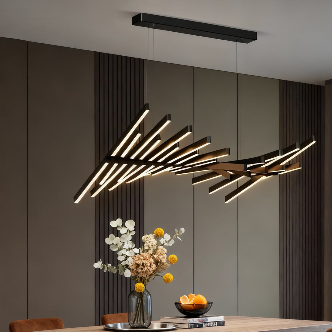 Modern dining area featuring a striking black art pendants light with asymmetrical rod design.