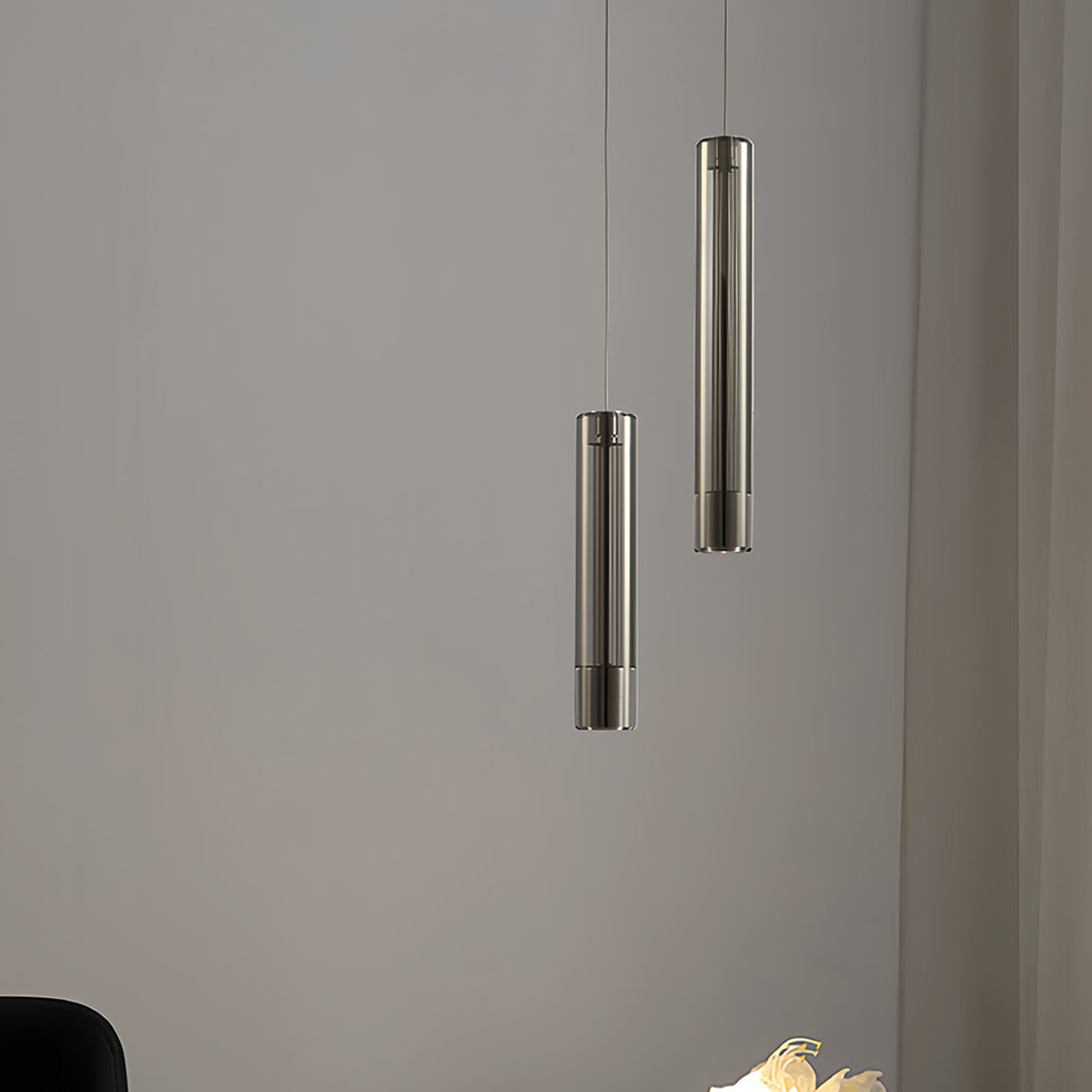 Modern double hanging pendant lights creating symmetrical lighting design in sophisticated interior space