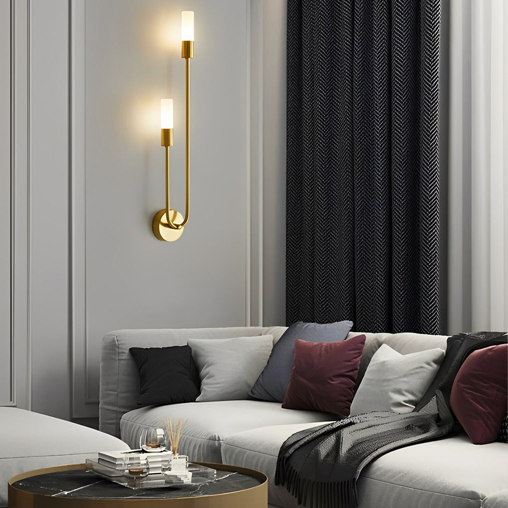 Modern double heads wall sconce with a close-up of its glowing double light bulbs.