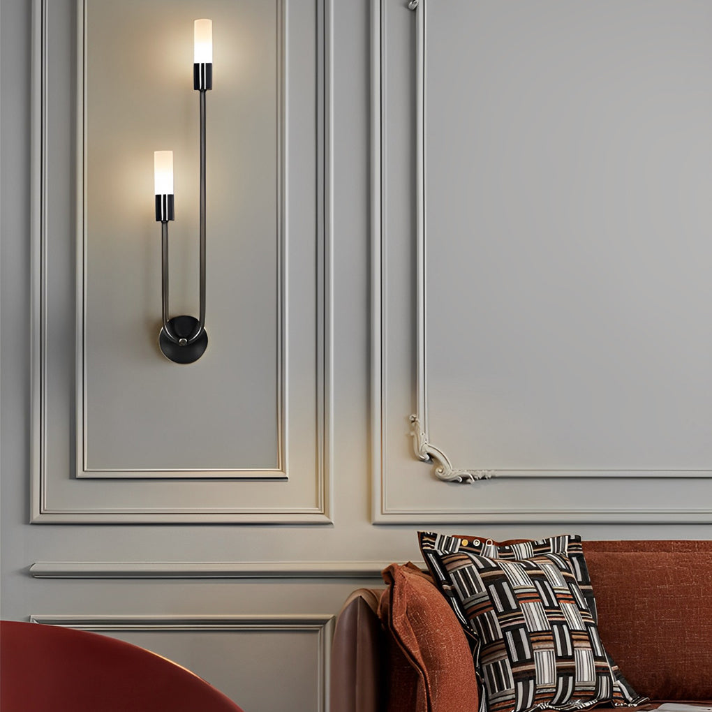 Modern double heads wall sconce with a close-up of its gold arm and light detail.