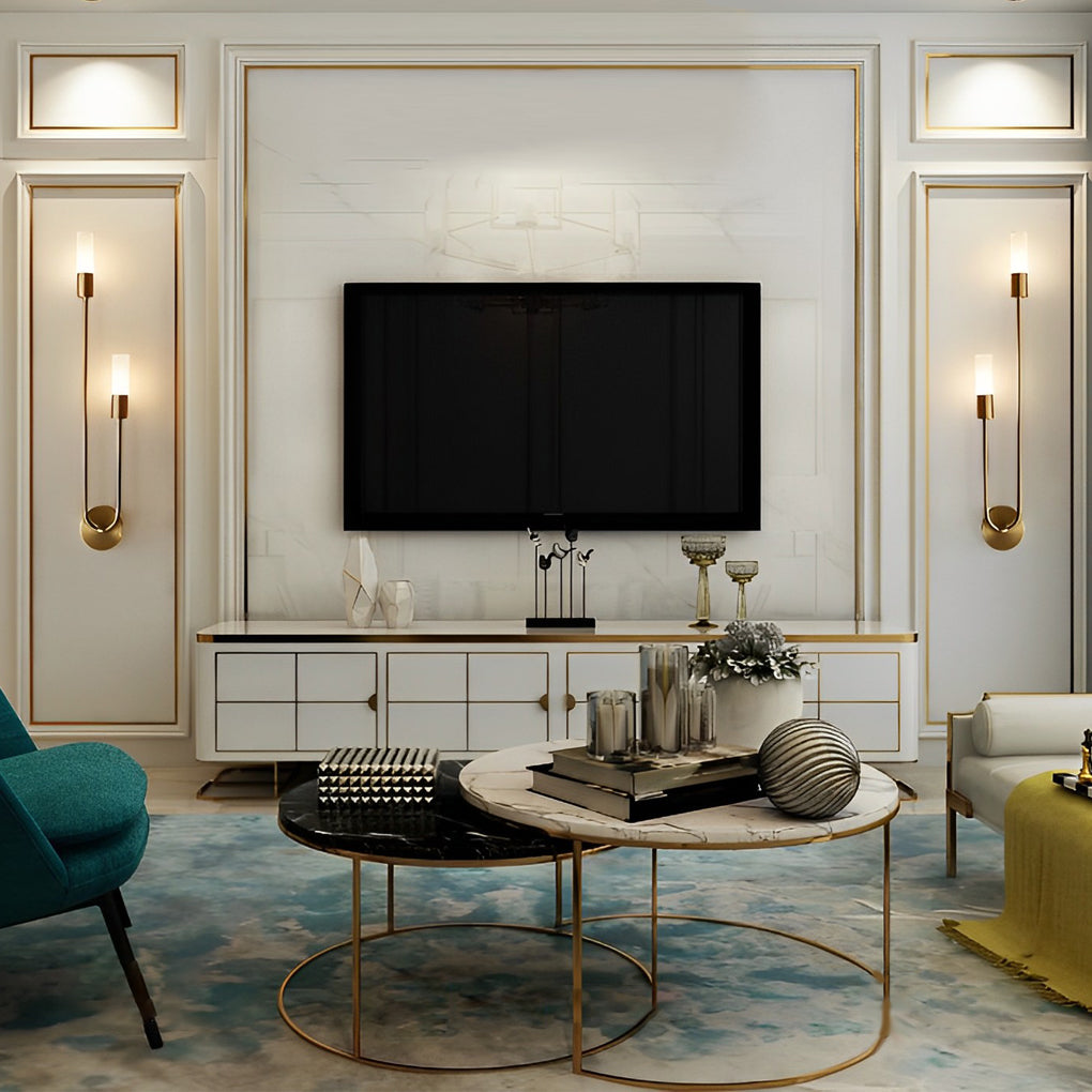 Modern double heads wall sconce with a gold finish, illuminating a stylish living room.