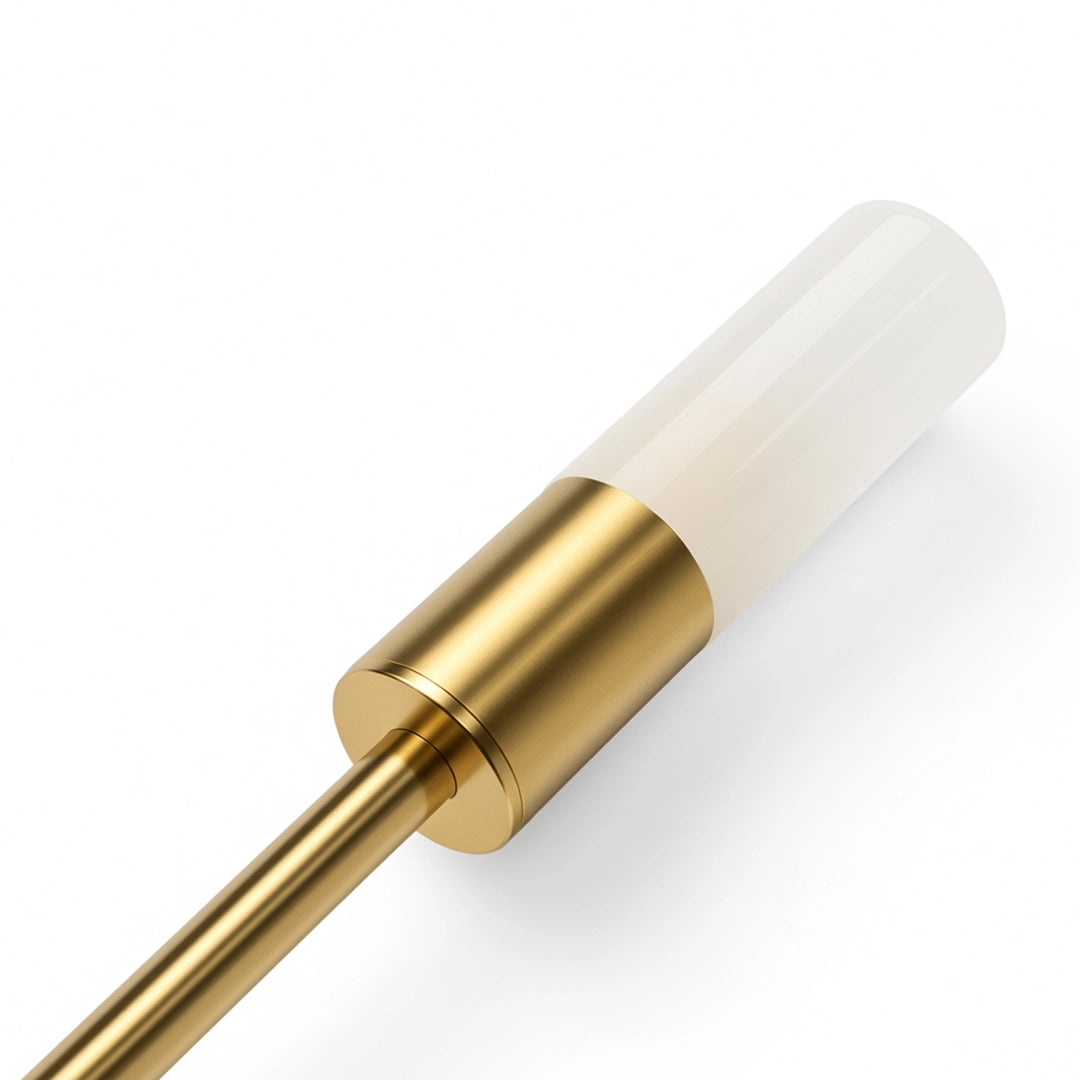 Close-up of the frosted light tube and gold metal holder on a modern double heads wall sconce.
