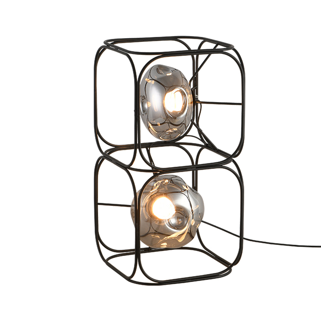Modern black desk lamps with dual-tier wire cage construction and exposed Edison bulb design