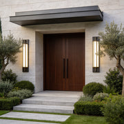 Modern home entrance illuminated by Large Outdoor Wall Light fixtures with sleek vertical black frame design.