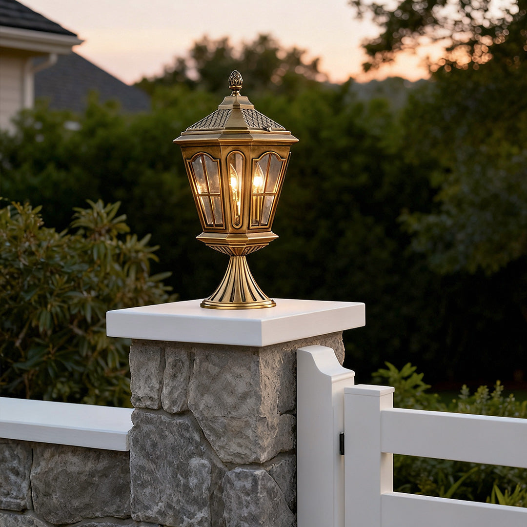 Modern exterior pillar mount lights providing soft illumination for a garden pathway at dusk.