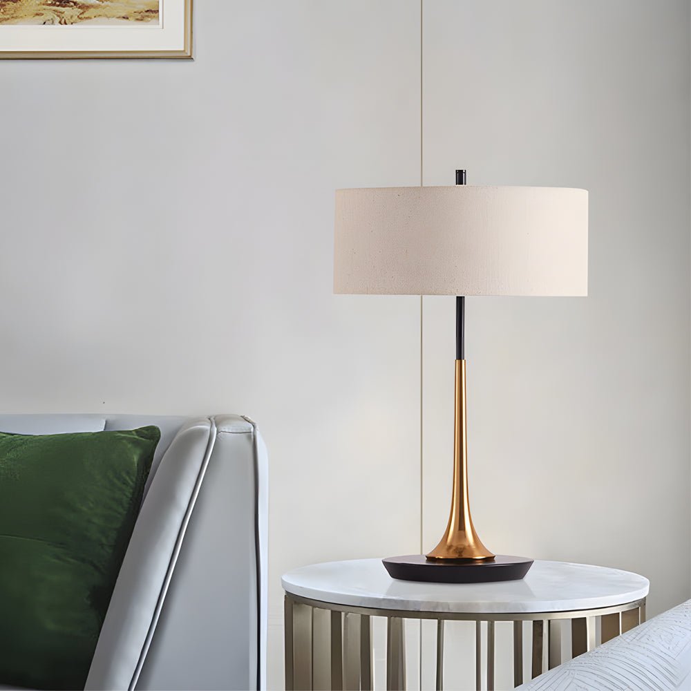 Modern fabric table lamp with linen shade on a marble side table in a chic living room corner.