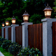 Pillar garden lights on a modern fence, elegant and functional outdoor lighting fixtures