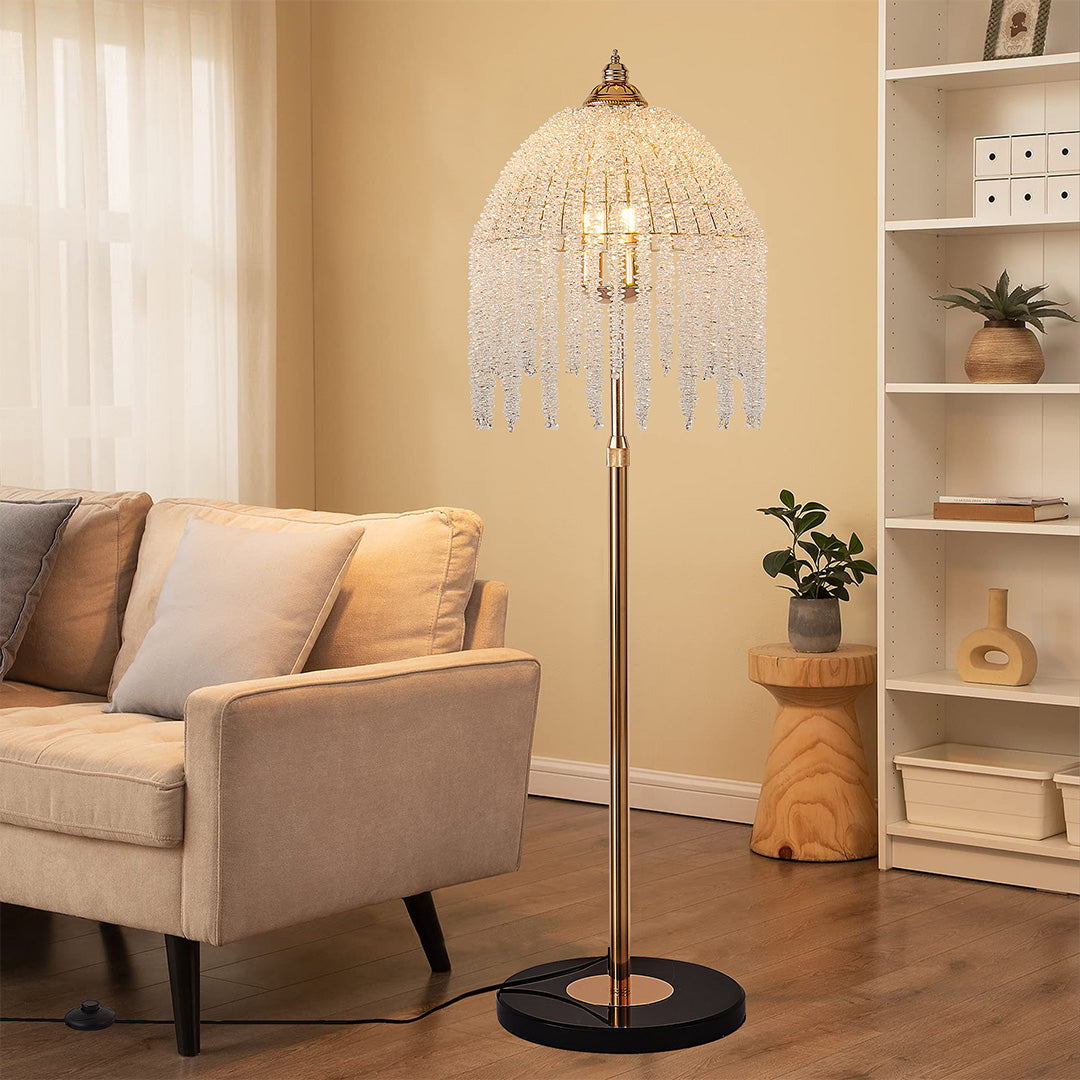 Warm and inviting living room highlighted by a gold teardrop floor crystal lamps with cascading crystals.