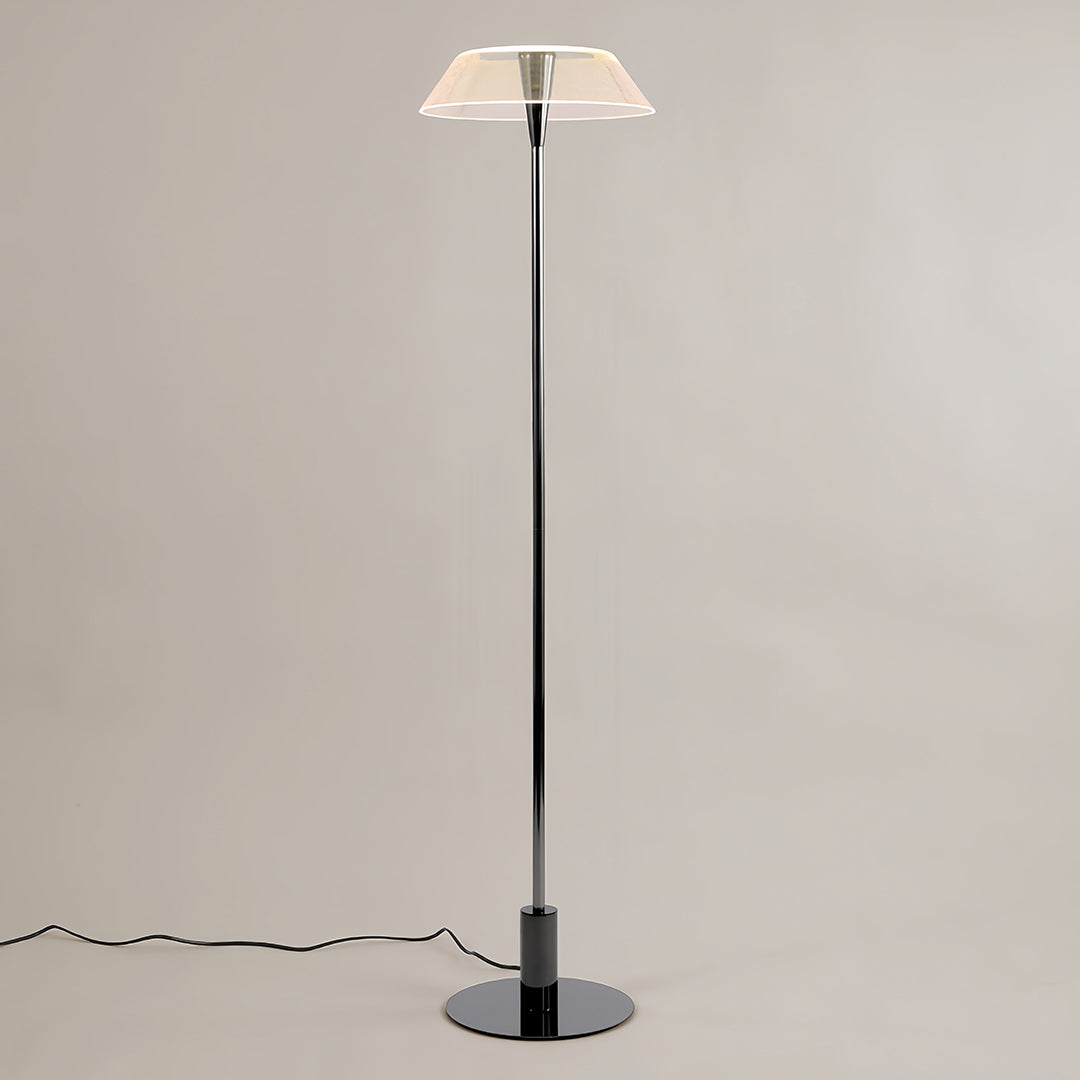 Modern floor lamp with a white translucent shade in a minimalist interior setting
