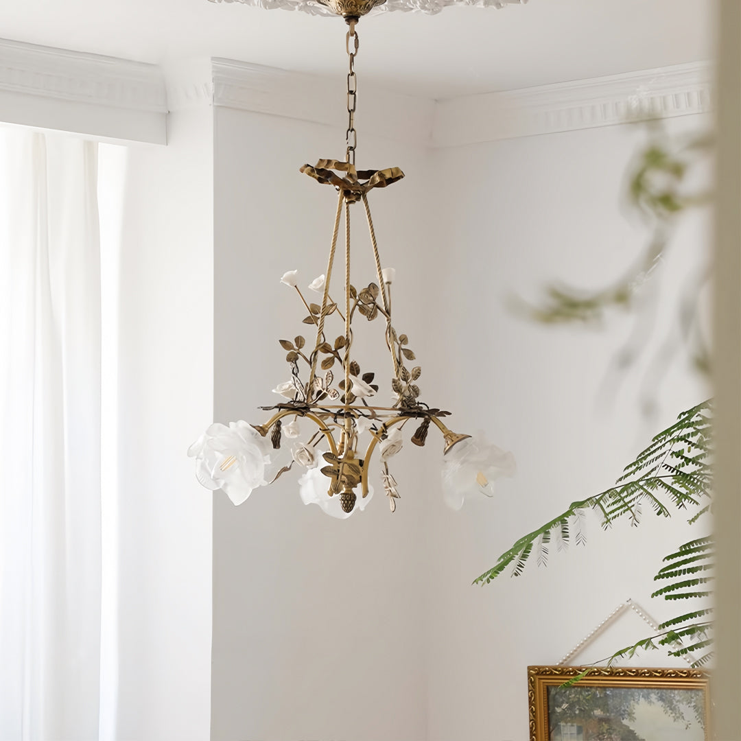 Modern flower chandelier hanging in serene space with white walls and botanical accents creating organic ambiance