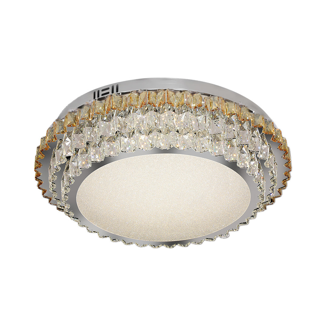 Modern flush mount light featuring a round design with gold and crystal details.