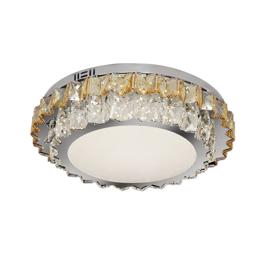 Modern flush mount light with a sleek round design and gold crystal accents, perfect for contemporary interiors.