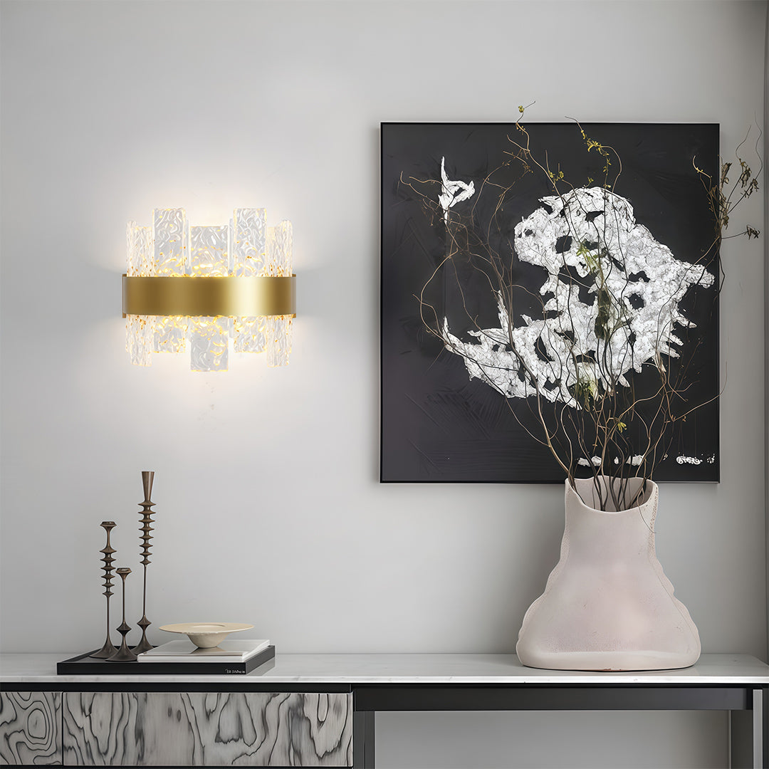 Modern forms chandelier above console with modern artwork and decorative vase