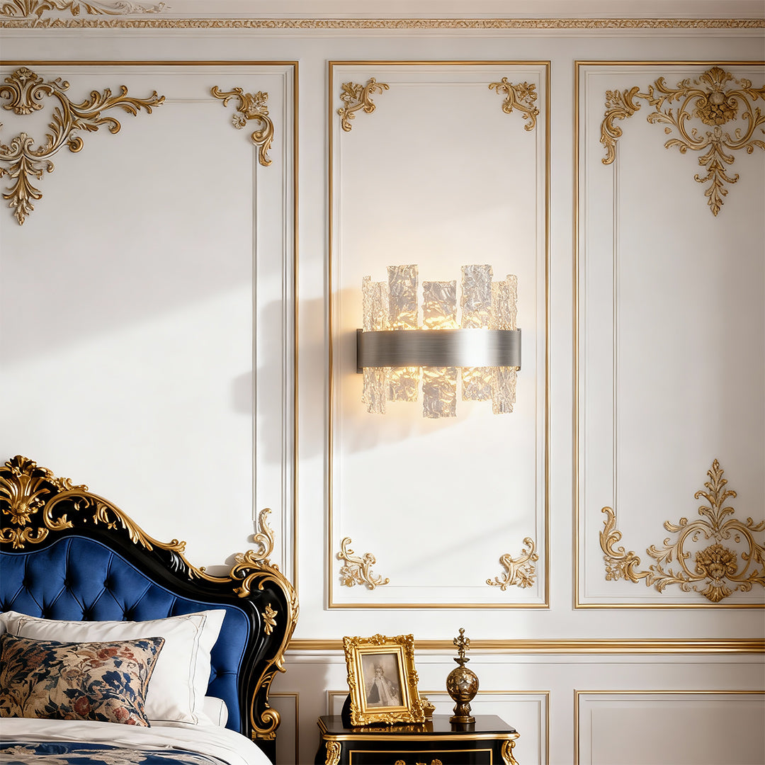 Modern forms chandelier illuminating elegant room with blue velvet sofa and ornate decor