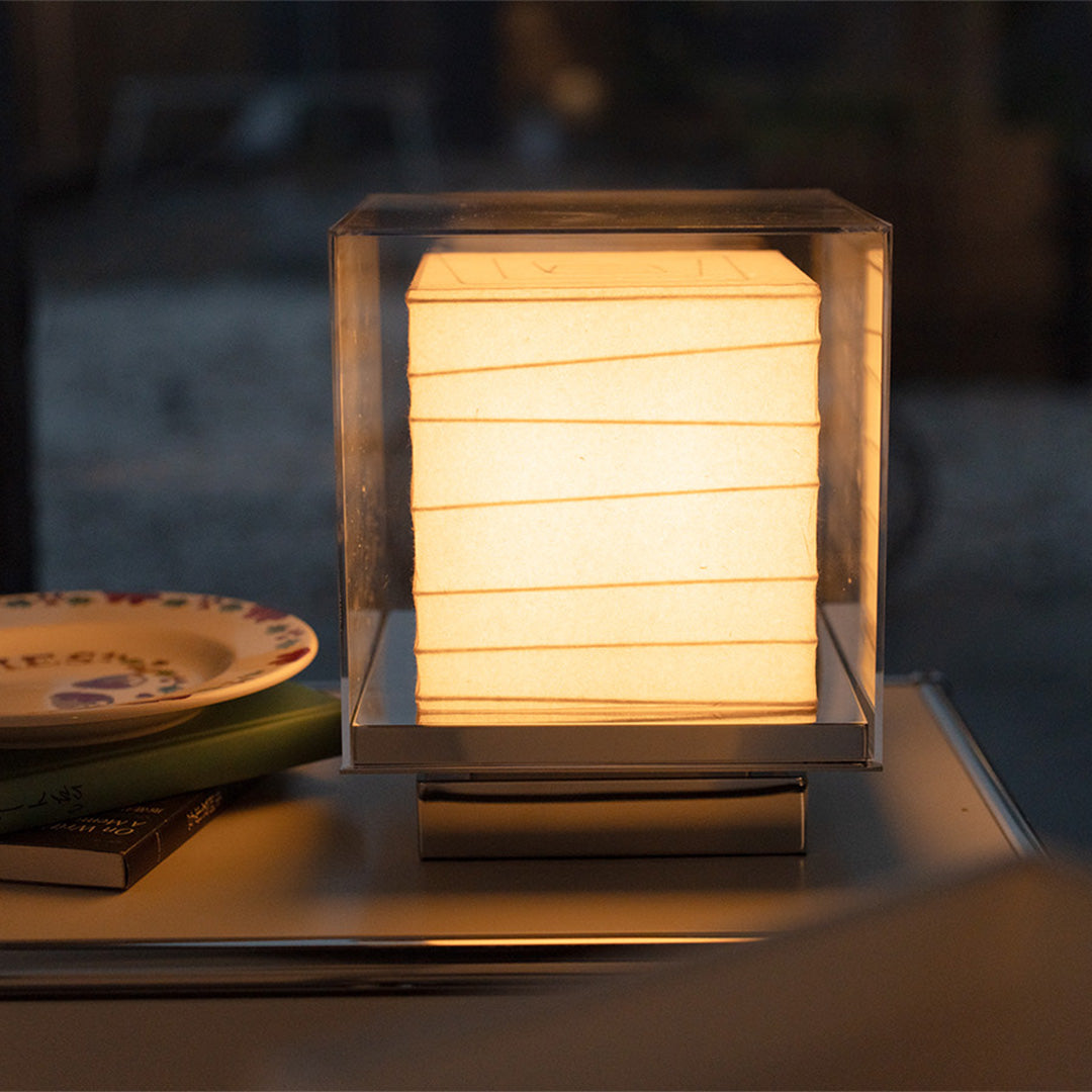 Japanese Paper Table Lamp with modern frame softly illuminating a dining area.