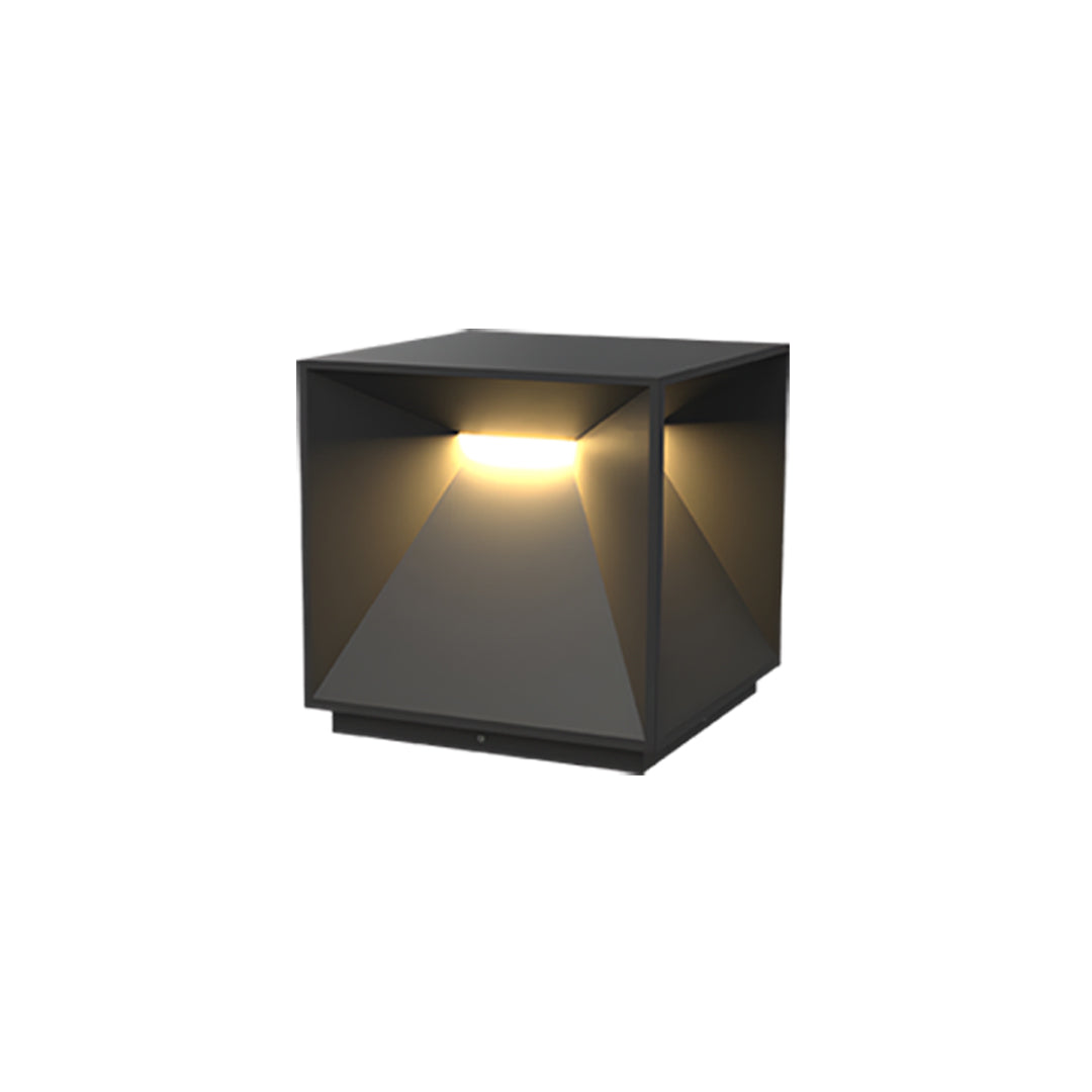 A compact modern garden pillar lights outdoor cube fixture featuring angled panels and soft ambient light.