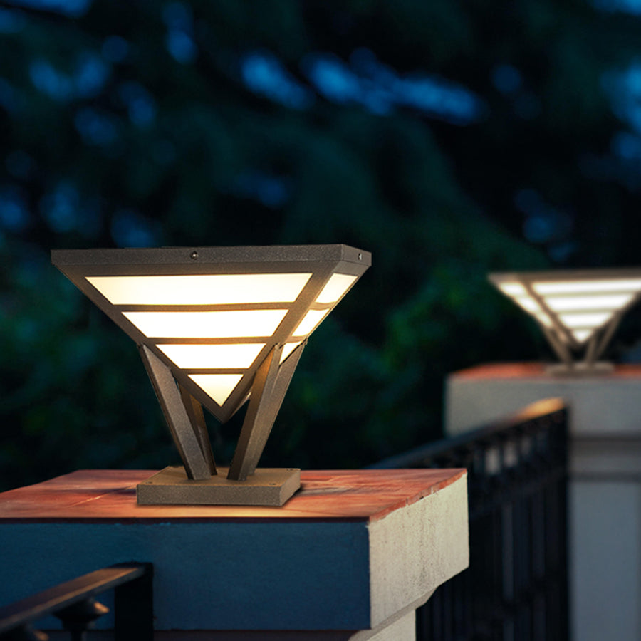 Modern gate pillar light close-up showing warm outdoor illumination.