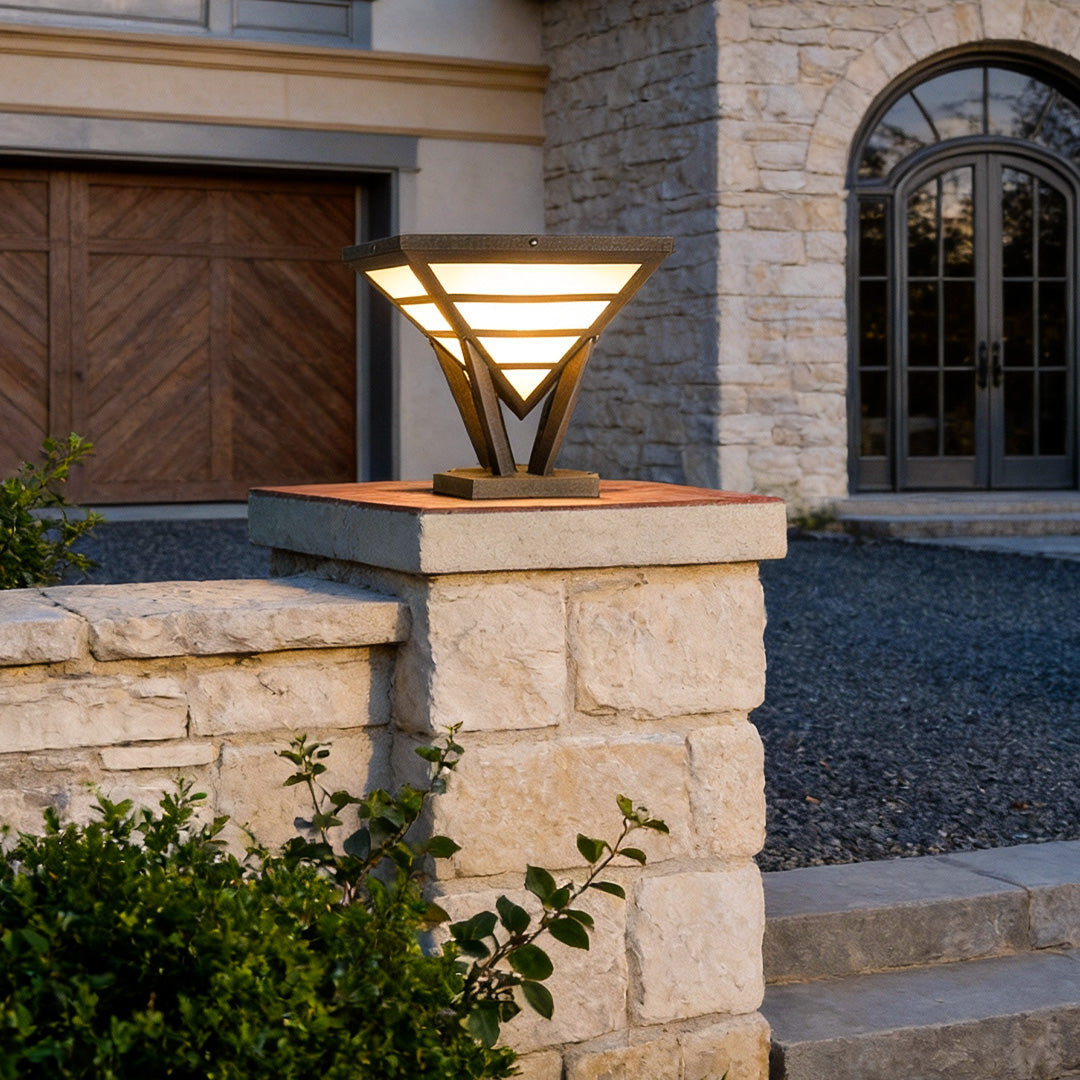 Modern gate pillar light mounted on a stone entrance column.
