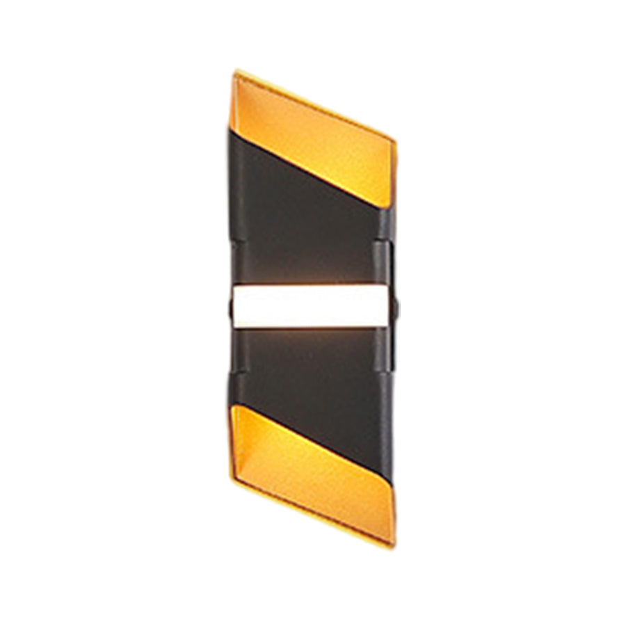 Modern geometric wall sconce with black and gold angular design creating up-down lighting