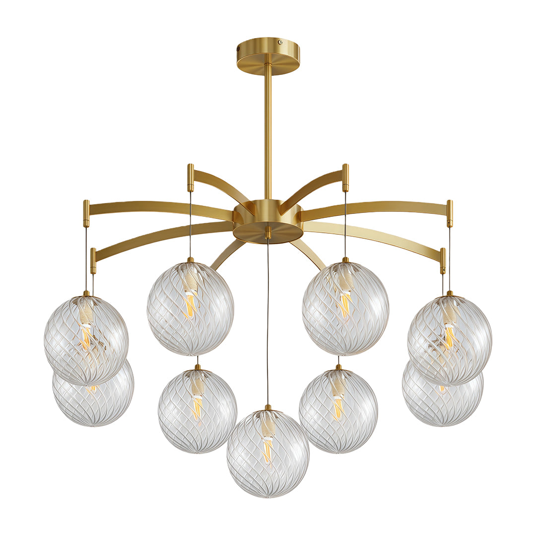 Modern glass ball chandelier with a gold frame, illuminating a dining area with a warm glow.