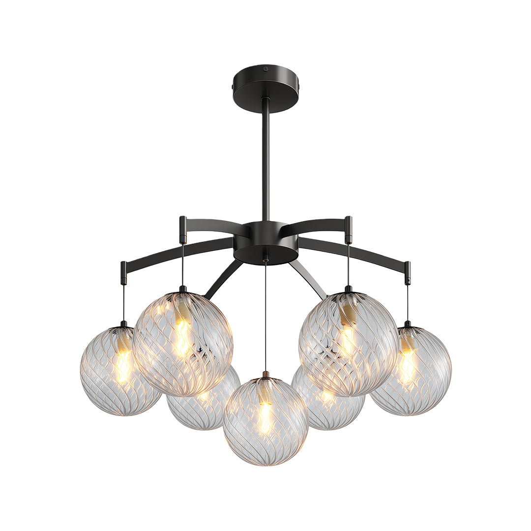 Modern glass ball chandelier with a silver frame, suspended above a dining table in a contemporary setting.