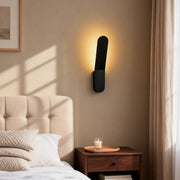 Modern glass pendant chandelier illuminating a cozy bedroom with warm, ambient glow.