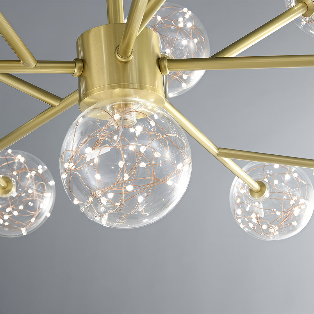 Modern luxury chandeliers close-up showcasing brass arms and textured glass globe detail