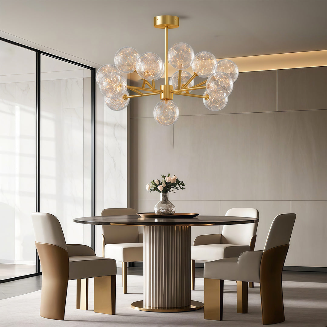Modern glass globe chandelier above contemporary dining table with fluted base and neutral seating