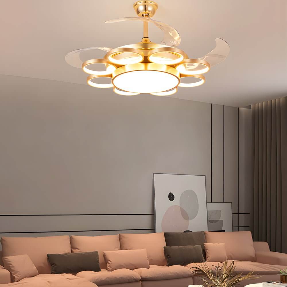 Modern gold ceiling fan with light, providing elegant illumination in a stylish living room.