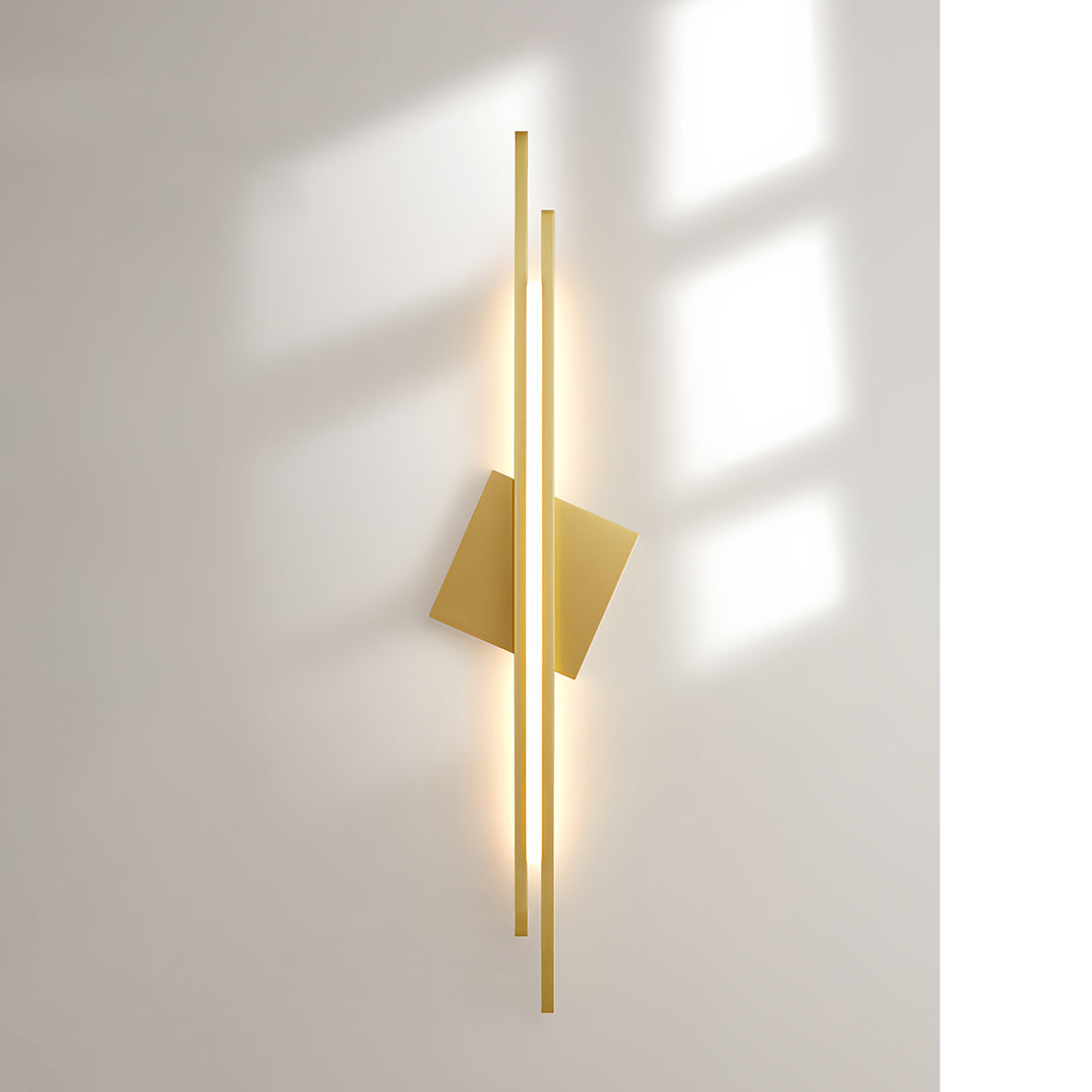 Modern gold metal floor lamp with a diamond-shaped shade in a cozy living room setting