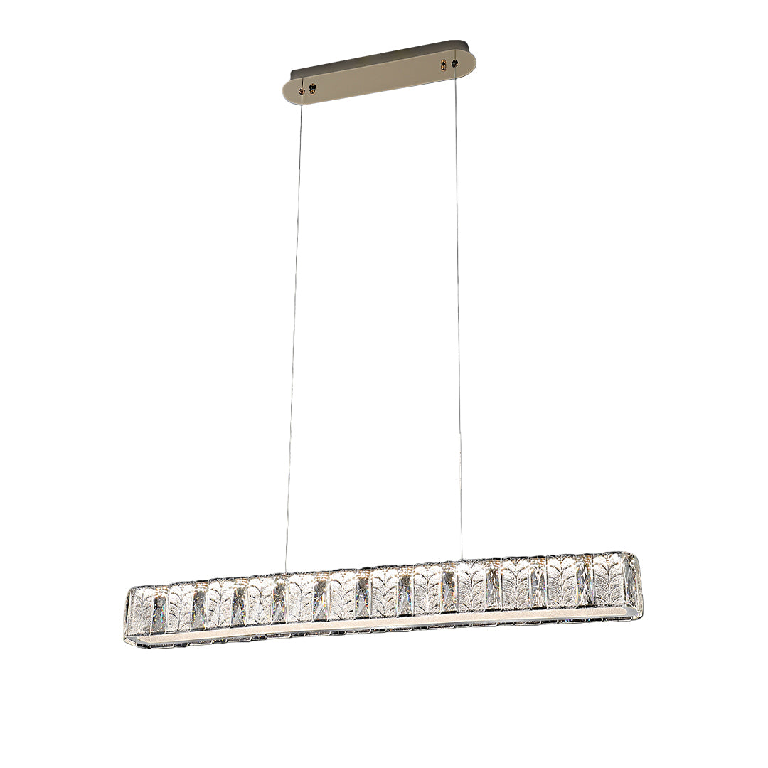 Modern gold pendant light in a dark-themed dining room, creating an elegant and luxurious atmosphere.