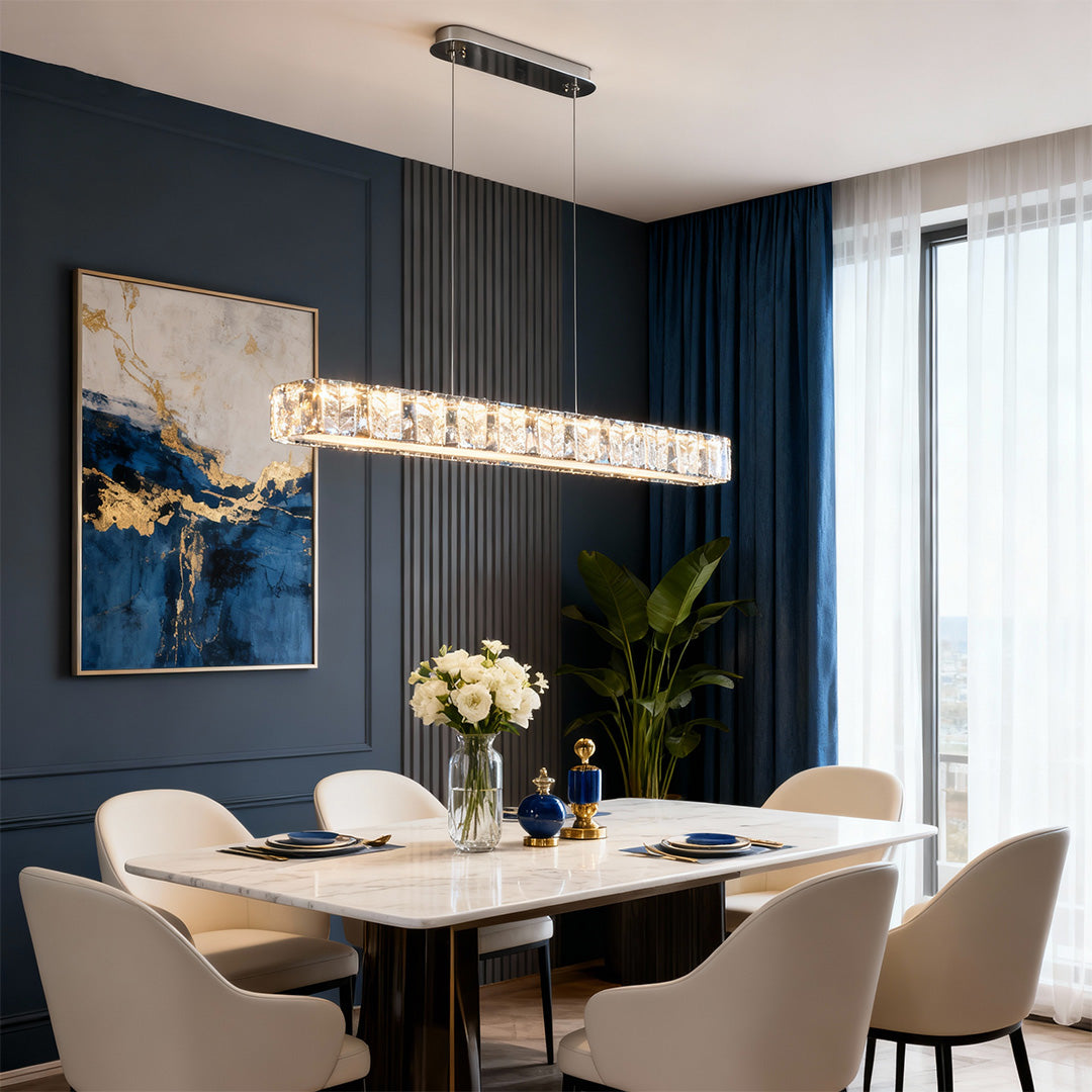 Modern gold pendant light above a kitchen island, adding a stylish touch to the space.