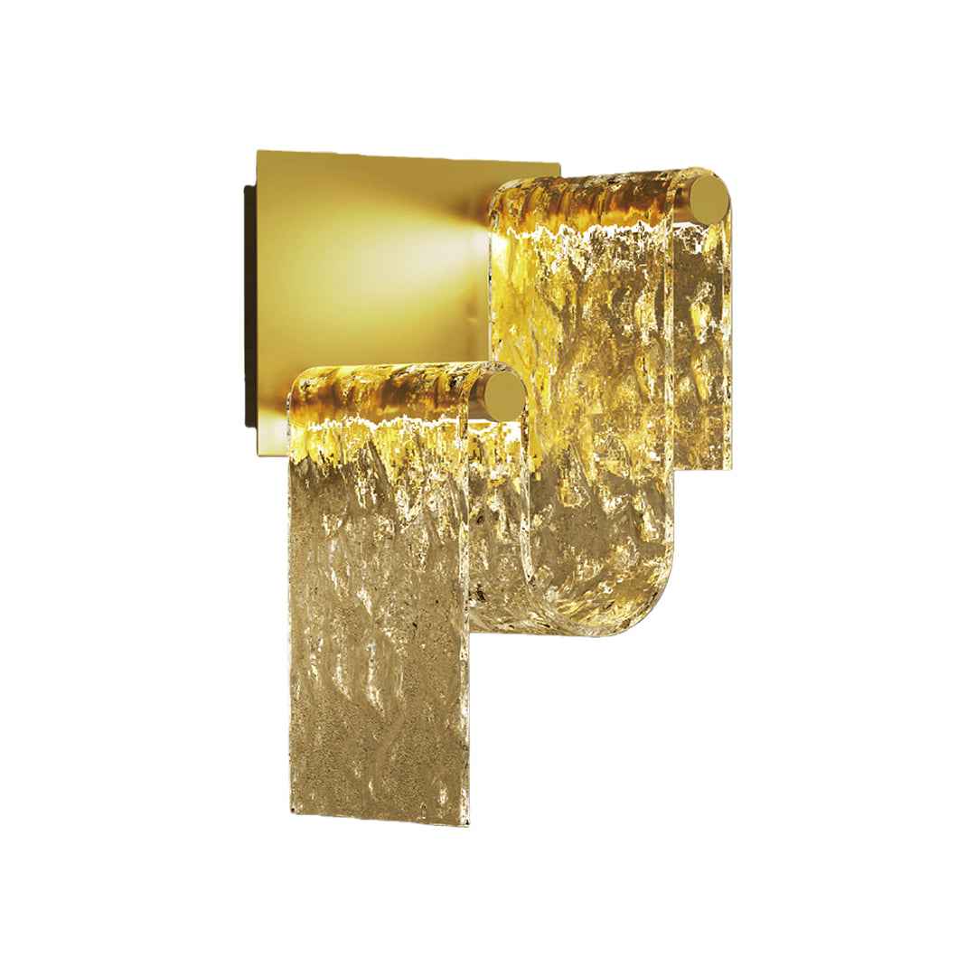 Modern gold wall light featuring cascading textured glass panels with brass mounting bracket on white background