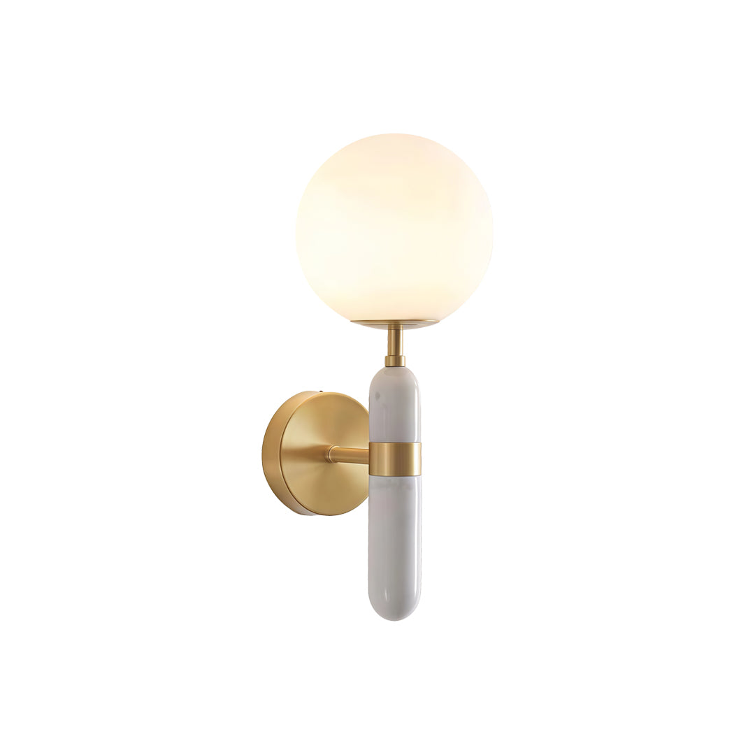 Modern gold wall sconce lighting with a glowing globe shade isolated on white background ok
