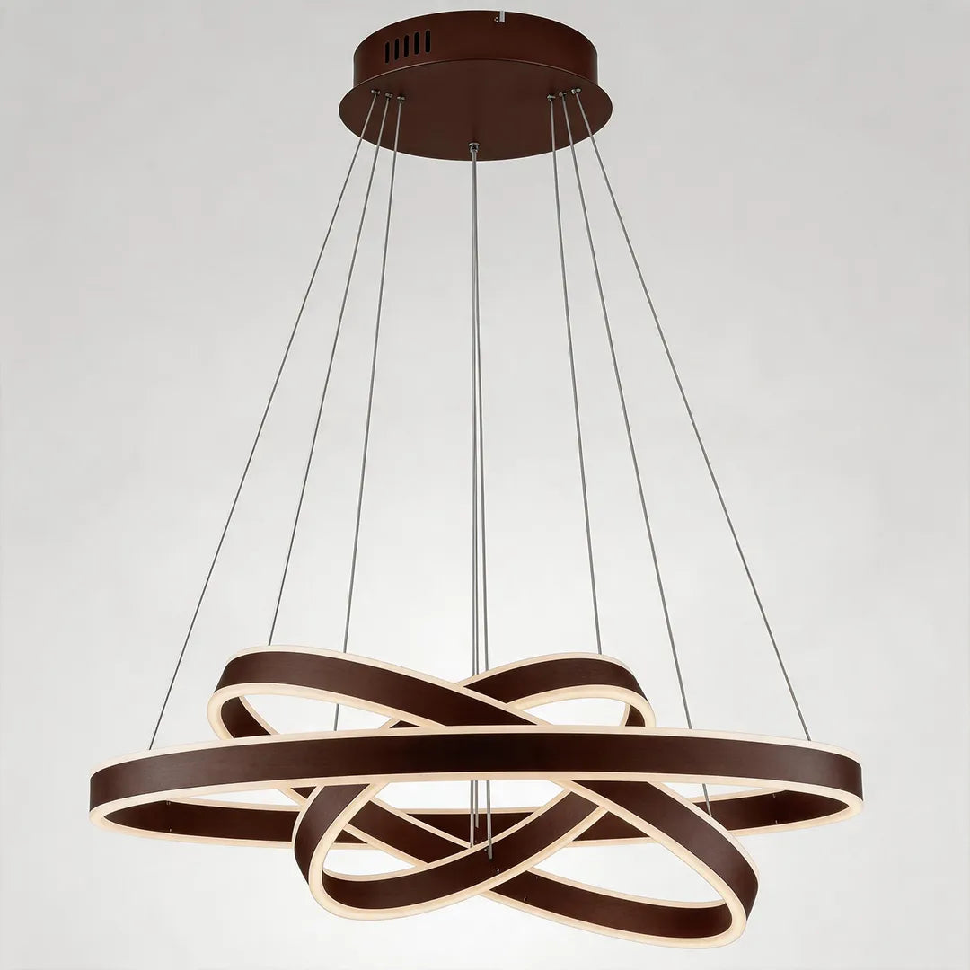 Modern halo chandelier in a bronze finish with sculptural overlapping LED rings shown against a white background.