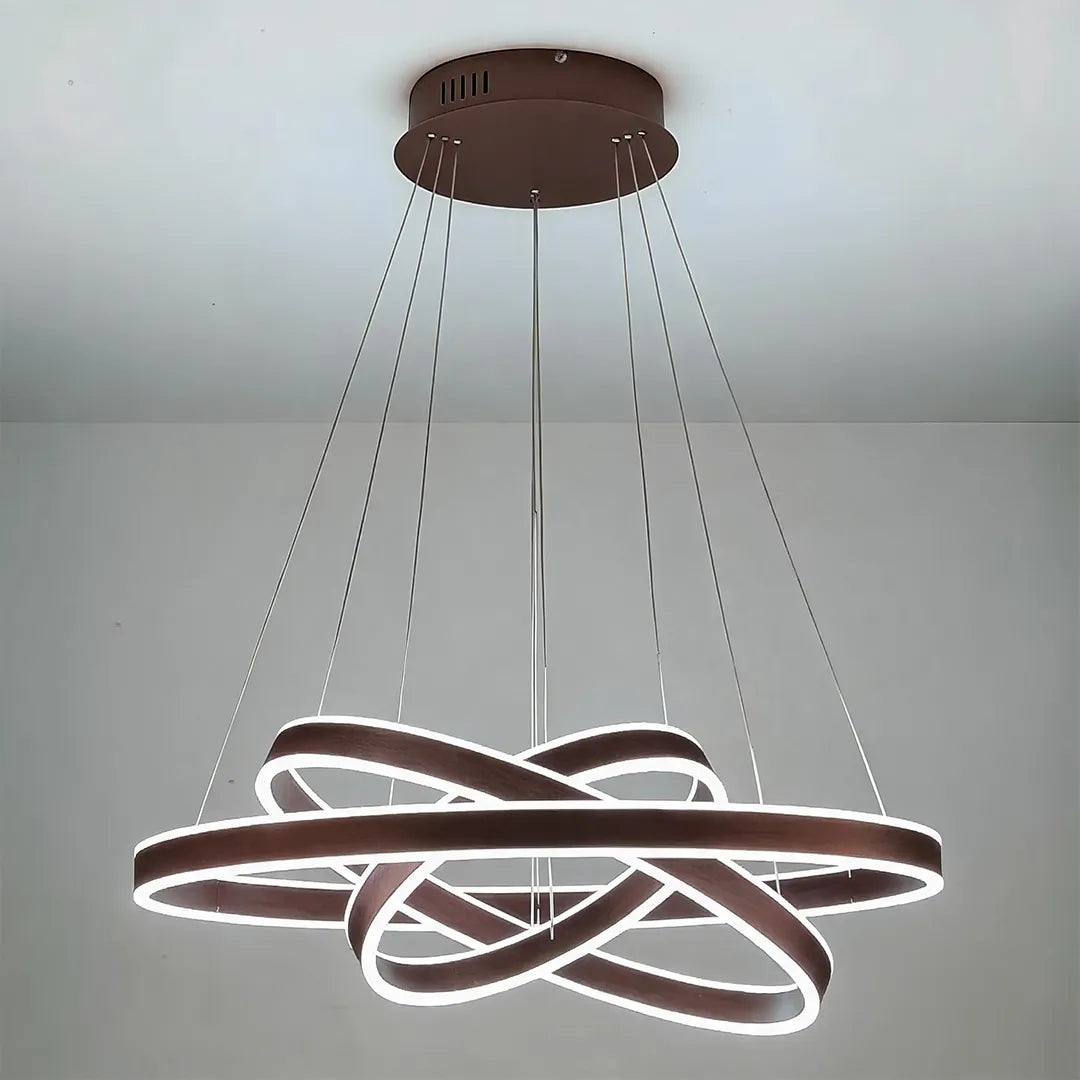 Modern halo chandelier with intertwined LED rings installed on a ceiling in a close-up product view.