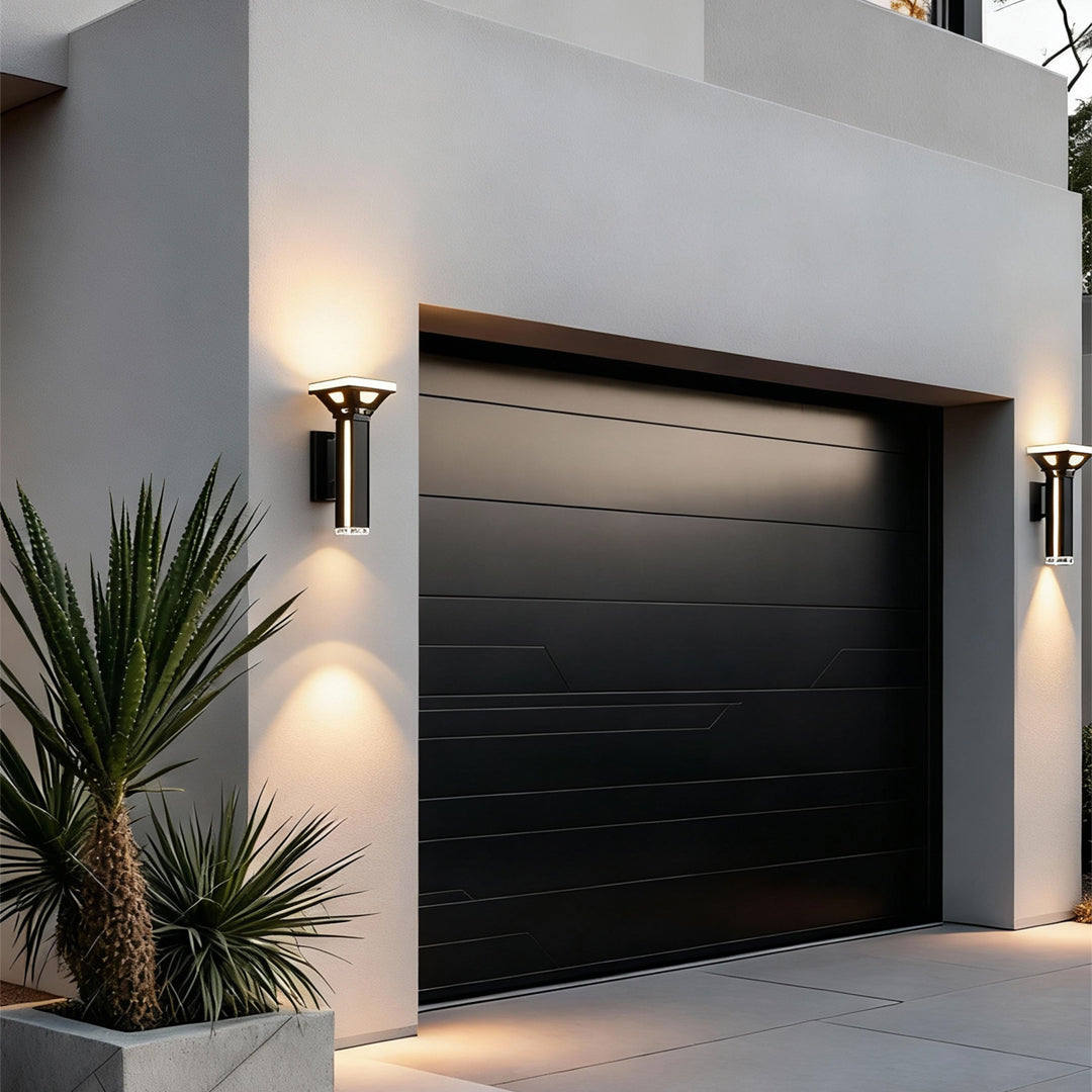 Contemporary black outdoor wall column lights used on a modern house wall.