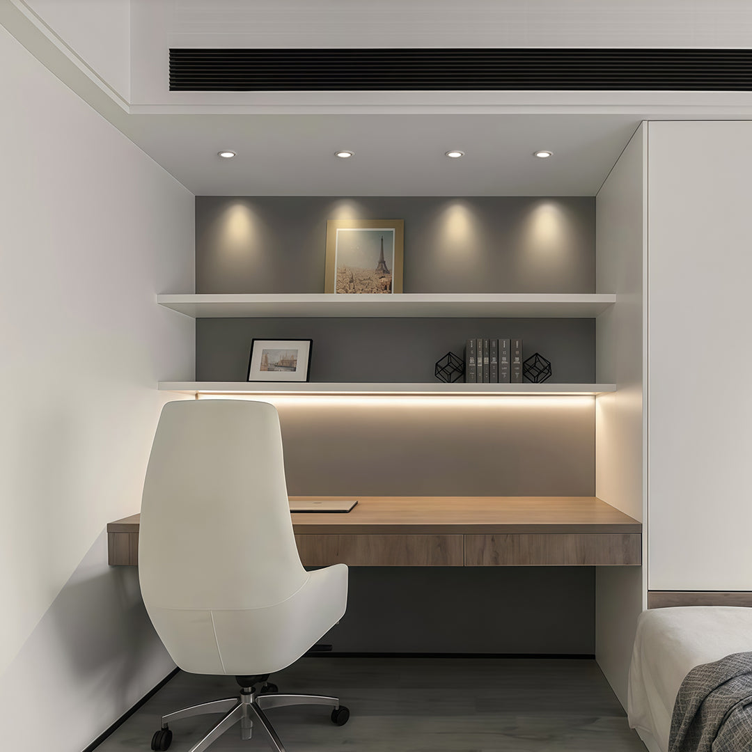 Modern indoor spotlights illuminating minimalist kitchen with glass shade chandelier inspired downlighting and sleek cabinetry.
