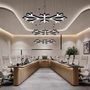 Modern industrial chandelier installed in a contemporary conference room, featuring geometric LED branches that create a bold and professional lighting focus.