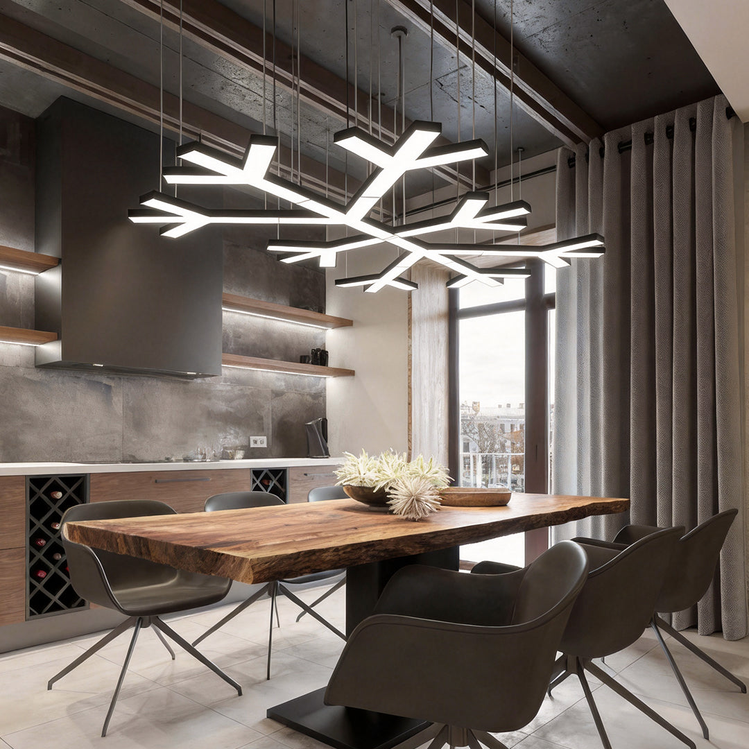 Modern industrial chandelier hanging above a stylish meeting table, combining angular LED arms with an urban loft-inspired interior.
