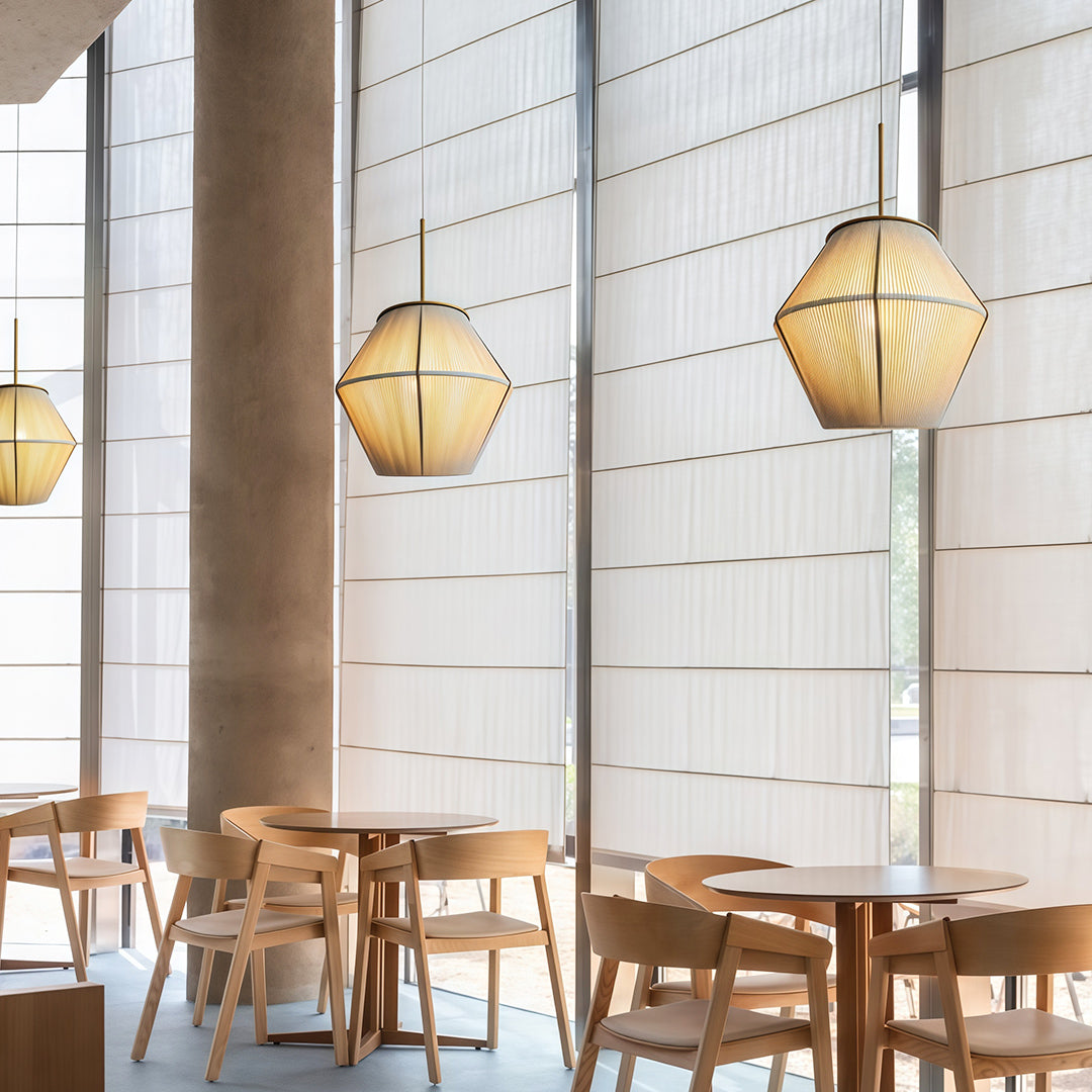 Modern Japanese-style pendant light fixture with a geometric design, perfect for brightening up any space.