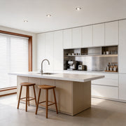Modern kitchen with recessed ceiling spotlight providing focused lighting over the island.