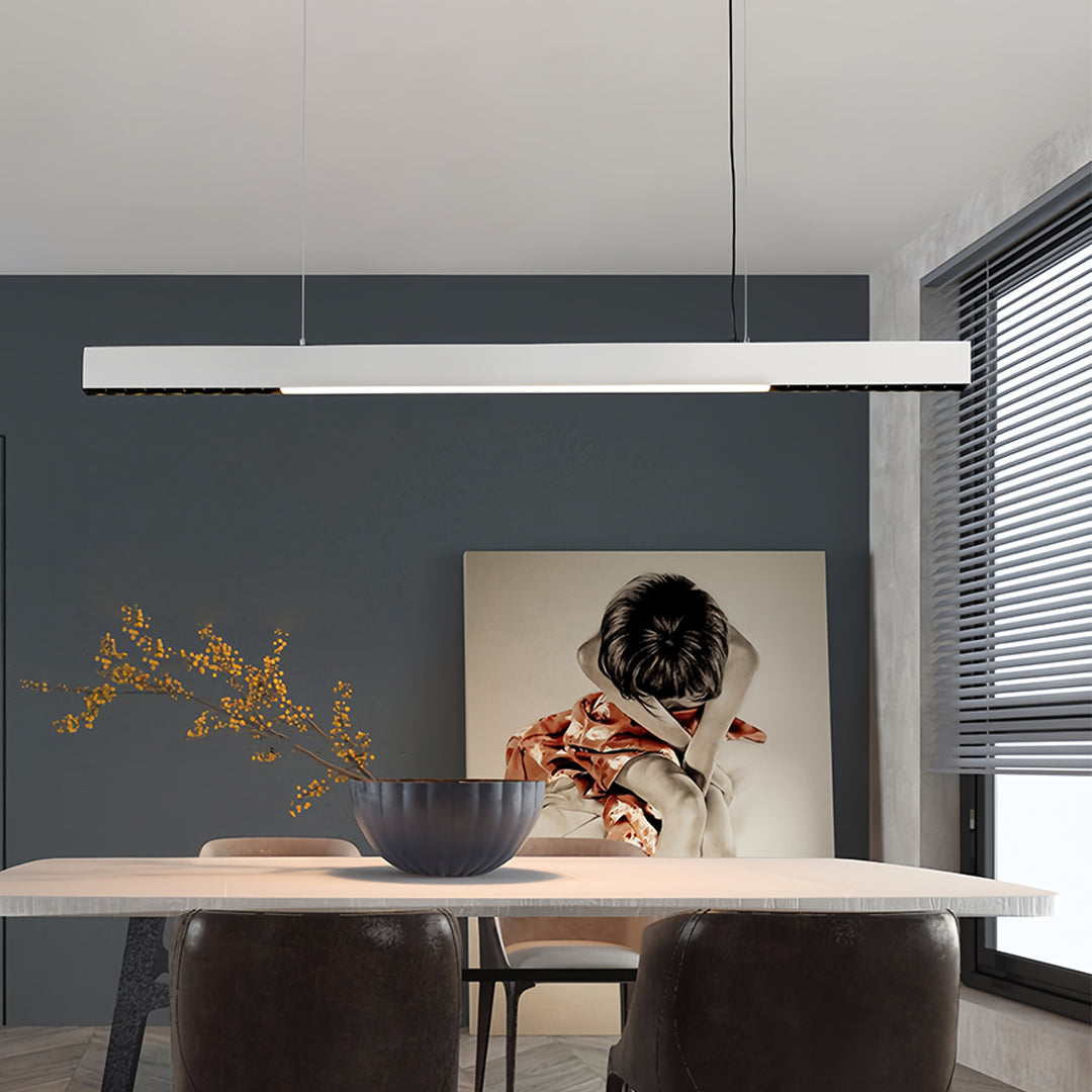 Modern kitchen with white linear light pendant providing task lighting over island workspace
