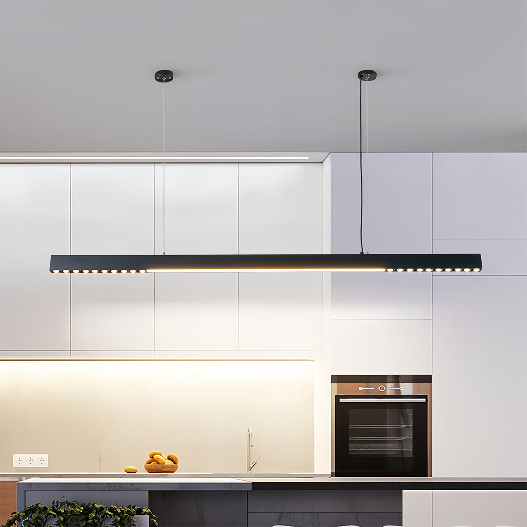 Modern kitchen with white linear light pendant providing task lighting over island workspace